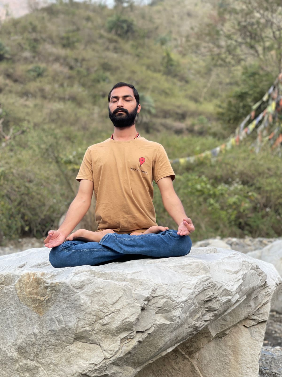 Hatha Yoga teacher Ayush performing Padmasana (Lotus Pose) is a cross-legged posture. 