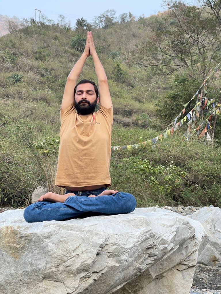 Hatha Yoga teacher Ayush performin Parvatasana (Mountain Pose) is an easy, simple effective seated posture. 