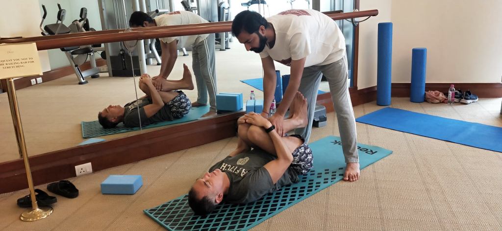 Hathayoga teacher Ayush teaching his yoga clients in Mumbai. 