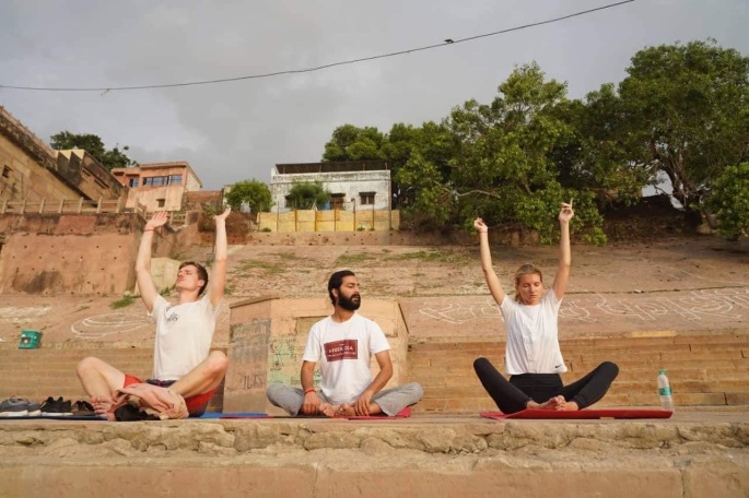 Hathayoga Teacher Ayush teaching his private class in Varanasi on the Ghat (overlooking Ganges). 