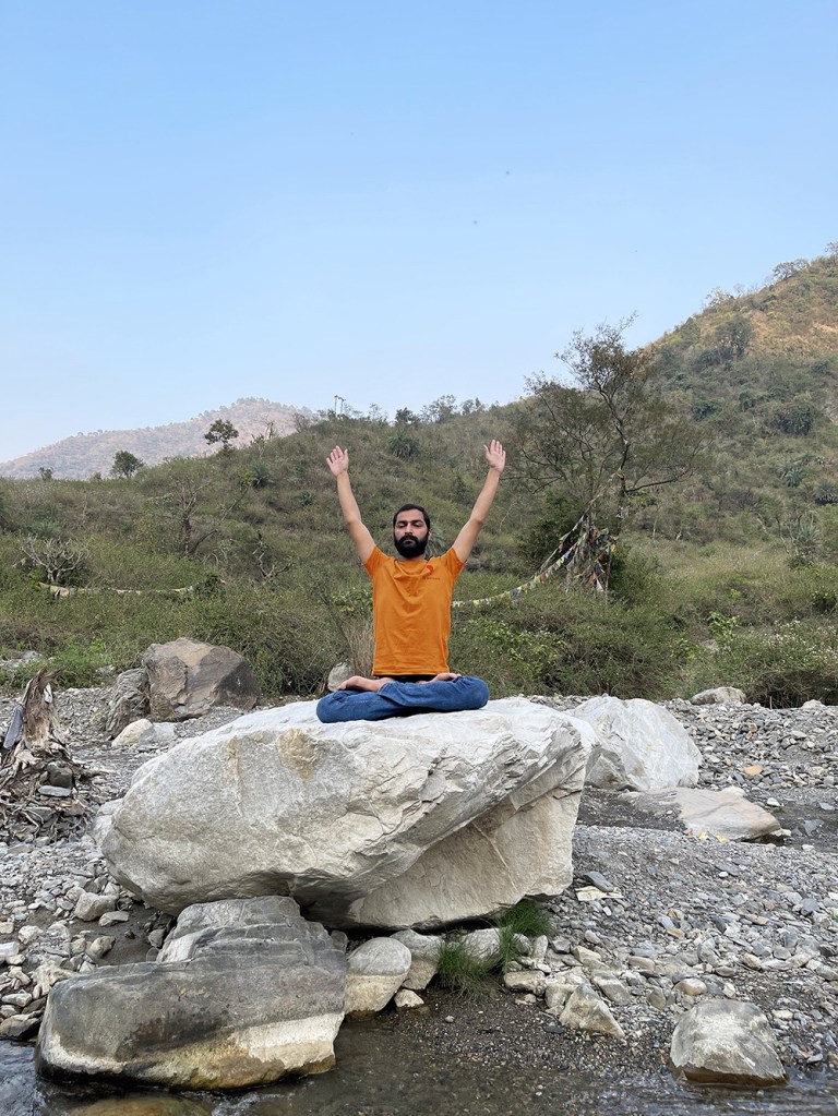 Hatha Yoga teacher Ayush performing Padma Parvatasana. 