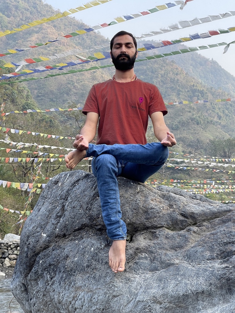 Hatha Yoga Teacher Ayush in Meditation Pose Gyan Mudra. 