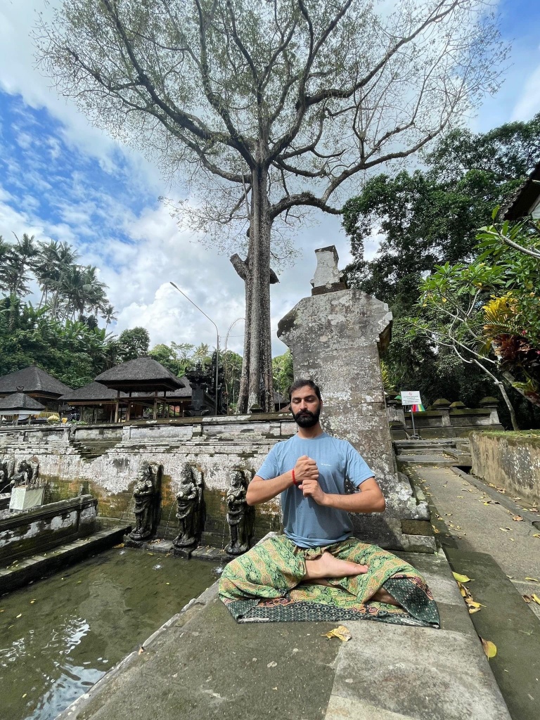 Hatha Yoga Teacher Ayush doing Meditation in Ardha Padmasana with Kundalini Mudra. 
Location Bali Indonesia.
