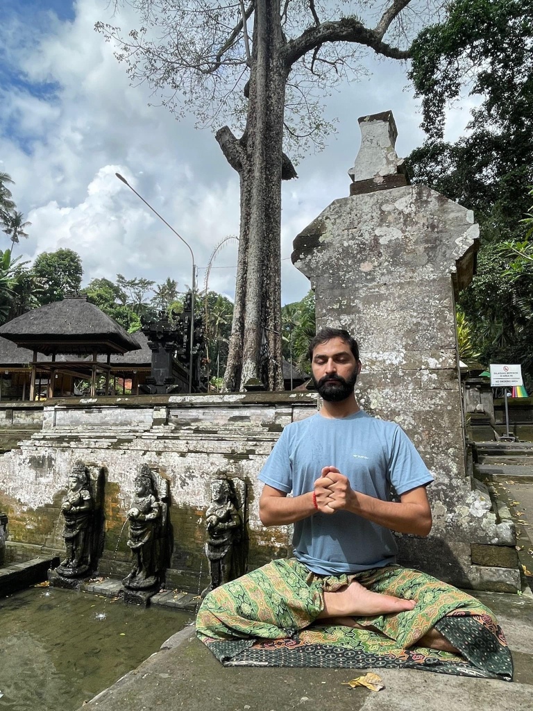 Hatha Yoga Teacher Ayush doing Meditation Dhyan in Ardha Padmasana with  Yogamudra. Located Bali Indonesia. 