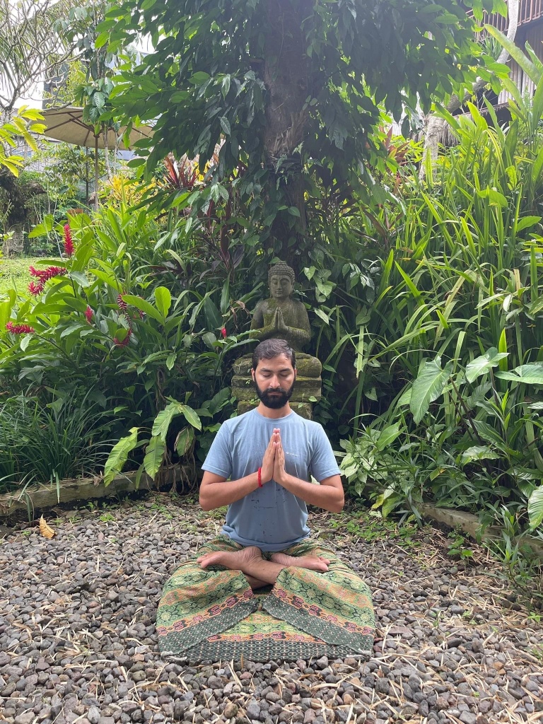 Hatha Yoga Teacher Ayush doing Meditation (Dhyan) in Padmasana with Namaste Mudra. 
Buddha.
Location Bali Indonesia.