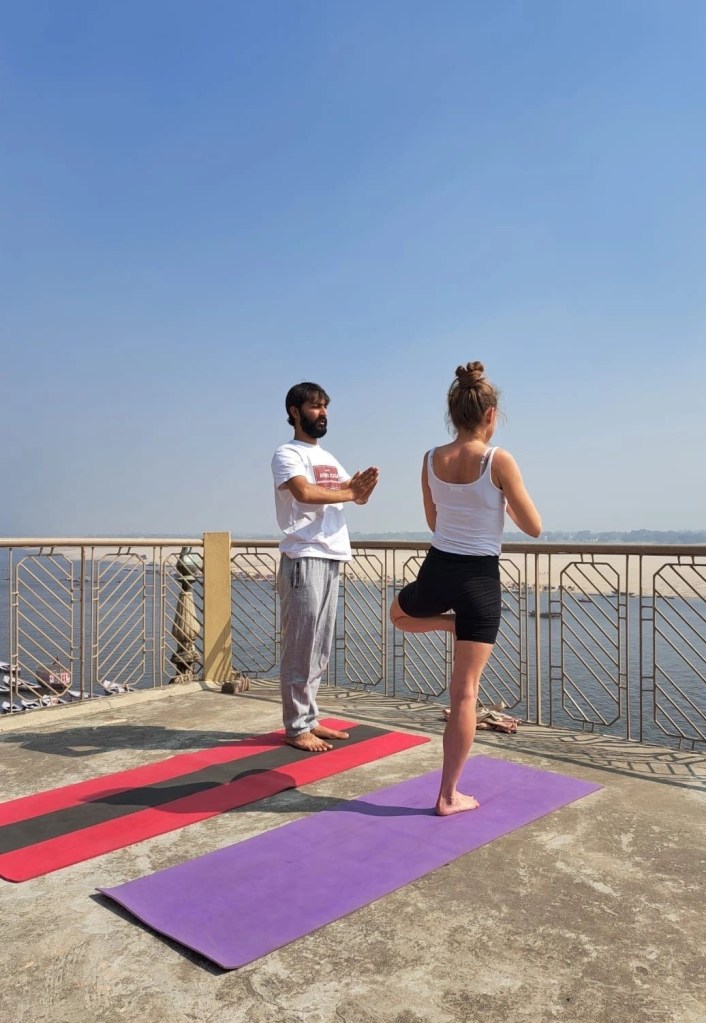 Yoga teacher Ayush student performing Vrikshasana.