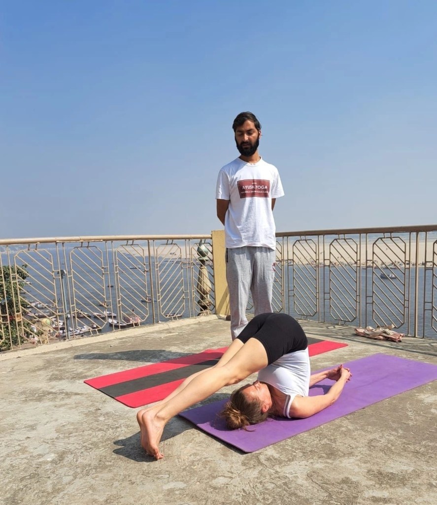 Yoga teacher Ayush student performing Halasana. 