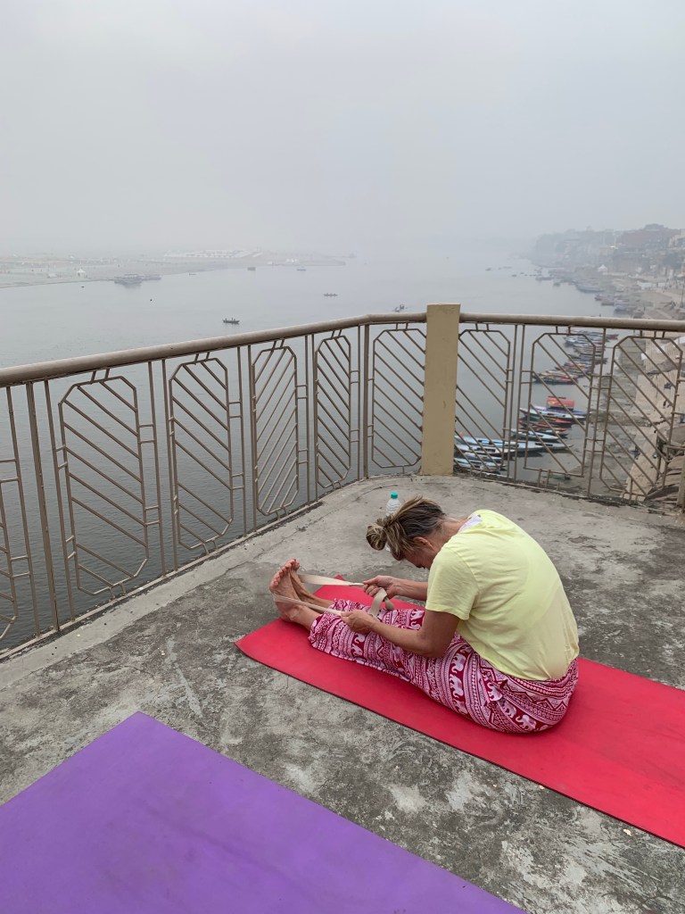 Yoga teacher Ayush student performing Paschimottanasana.
