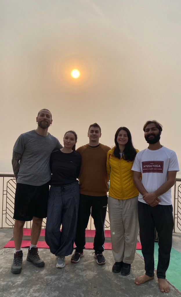 Yoga teacher Ayush with his students. 