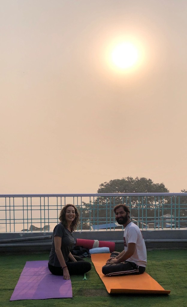 Yoga teacher Ayush with his student. 