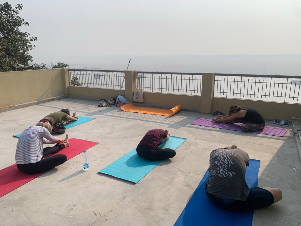 Yoga teacher Ayush students performing Janusirsasana.