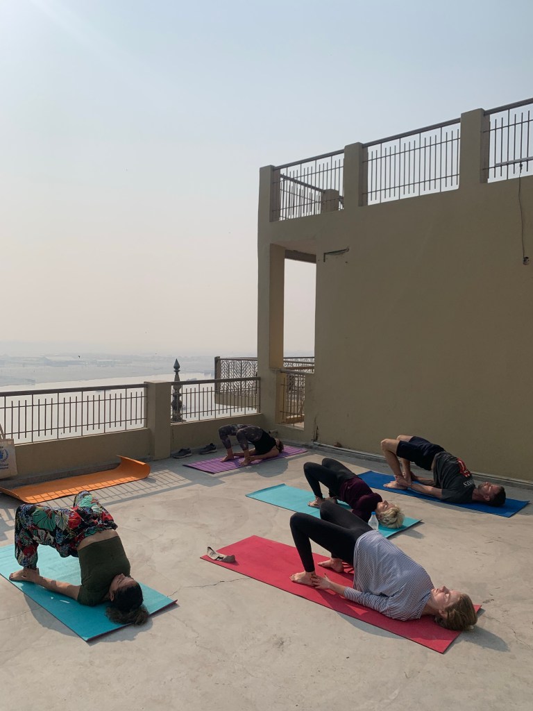 Yoga teacher Ayush students performing Setubandhasana.