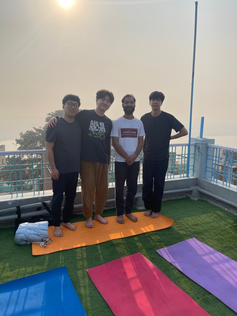 Yoga teacher Ayush with his students.