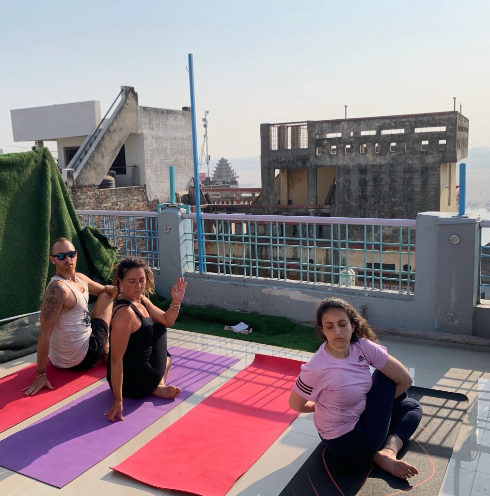 Yoga teacher Ayush students performing Ardhamatsyendrasana. 