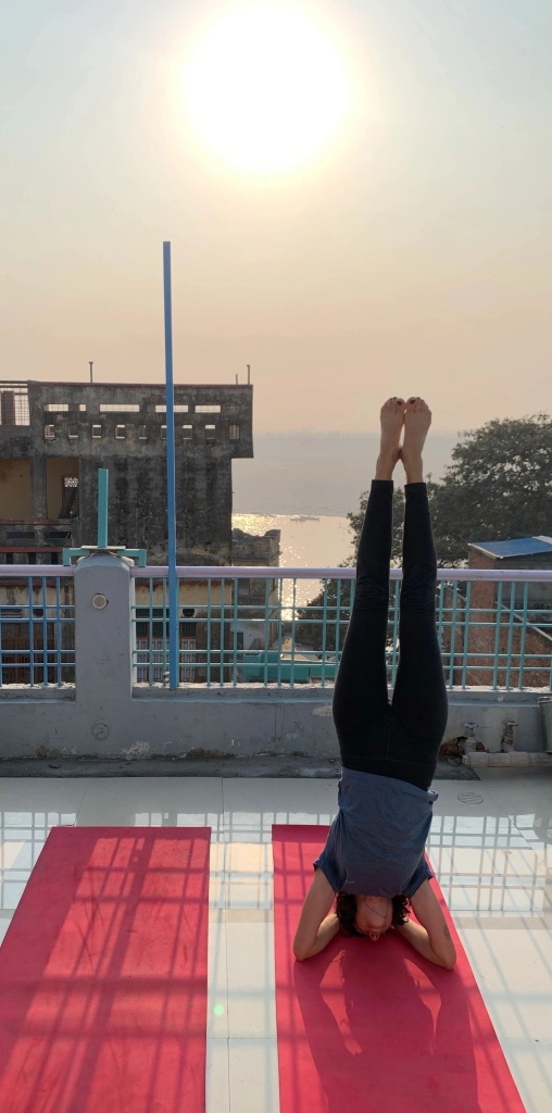 Yoga teacher Ayush student performing Sirshasana. 
