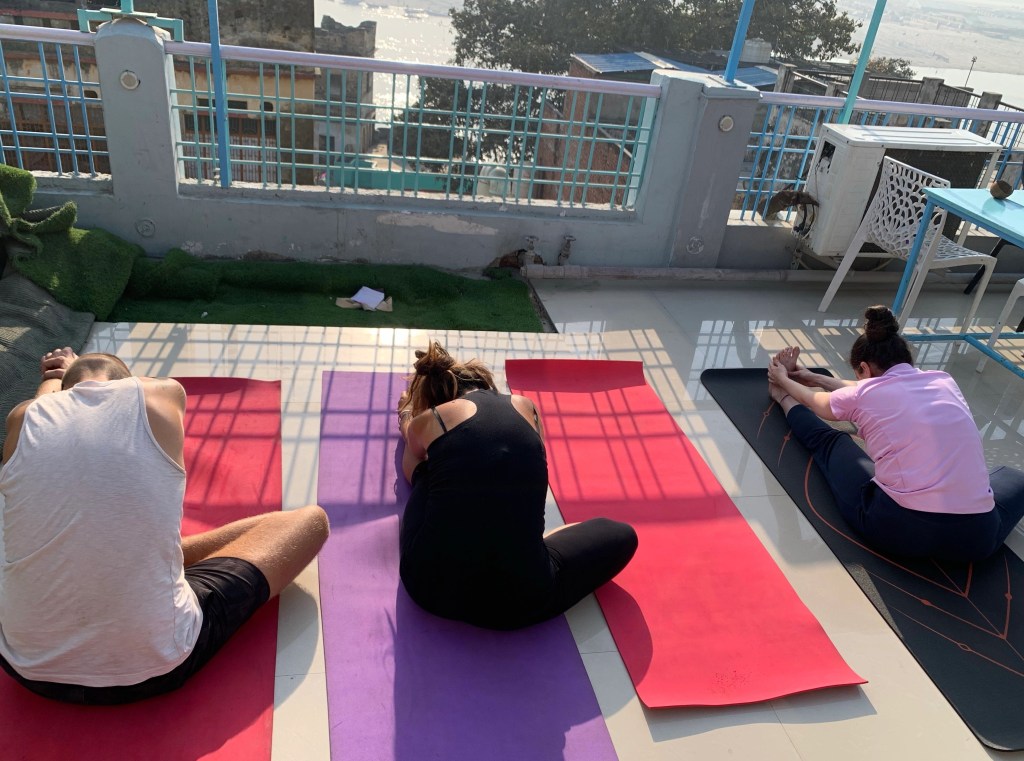 Yoga teacher Ayush students performing Janusirsasana.