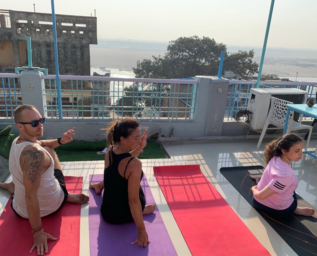Yoga teacher Ayush students performing Spinal Twist Pose. 