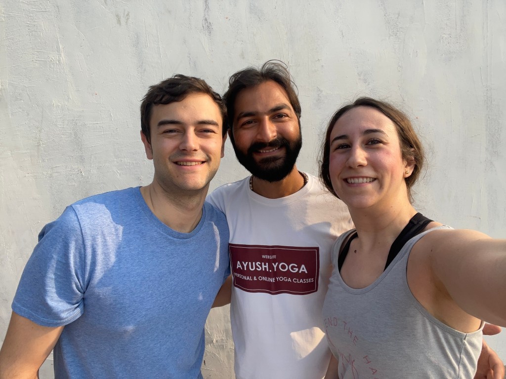 Yoga teacher Ayush students taking selfie with teacher.