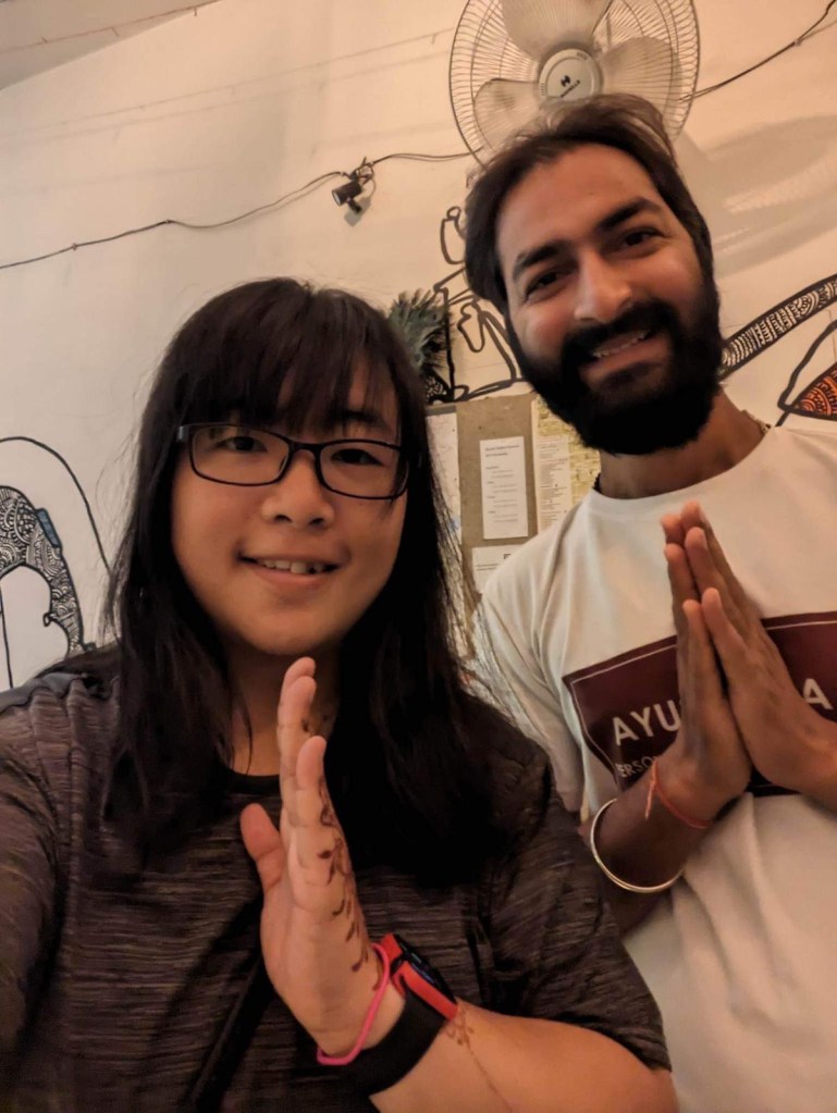 Yoga teacher Ayush with his student in Varnanasi after the session.