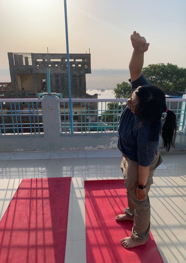 Yoga teacher Ayush student performing Trikonasana in Varanasi. 