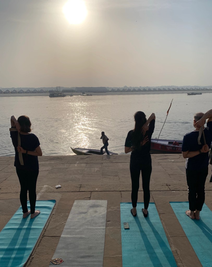 Yoga teacher Ayush students performing Gomukh Asana in Varanasi. 
