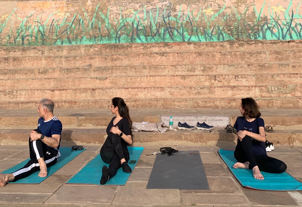 Yoga teacher Ayush students performing Ardhamatsyendrasana in Varanasi. 