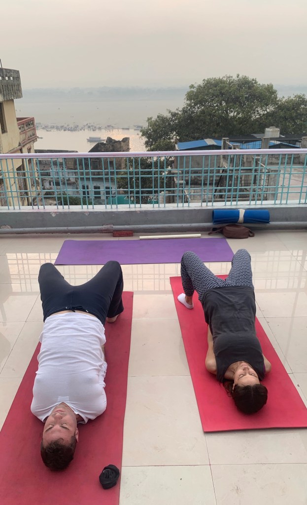 Yoga teacher Ayush students performing Setubandhasana. 