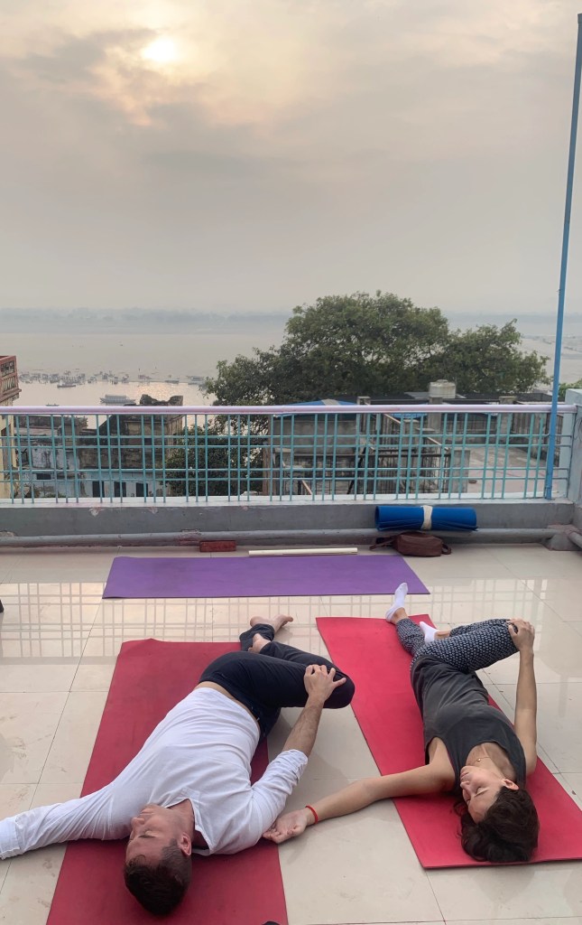 Yoga teacher Ayush students performing Supta Vakrasana. 