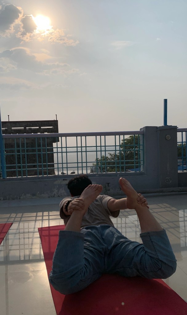 Yoga teacher Ayush student performing Dhanurasana.