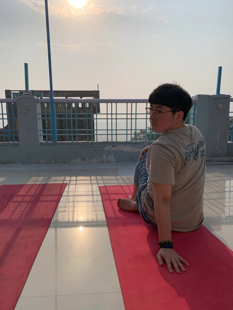 Yoga teacher Ayush student performing Ardhamatsyendrasana.