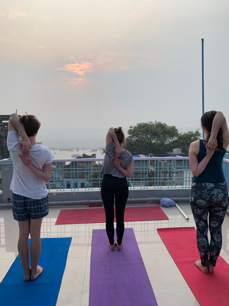 Yoga teacher Ayush students performing Tadasana Goumukhasana. 