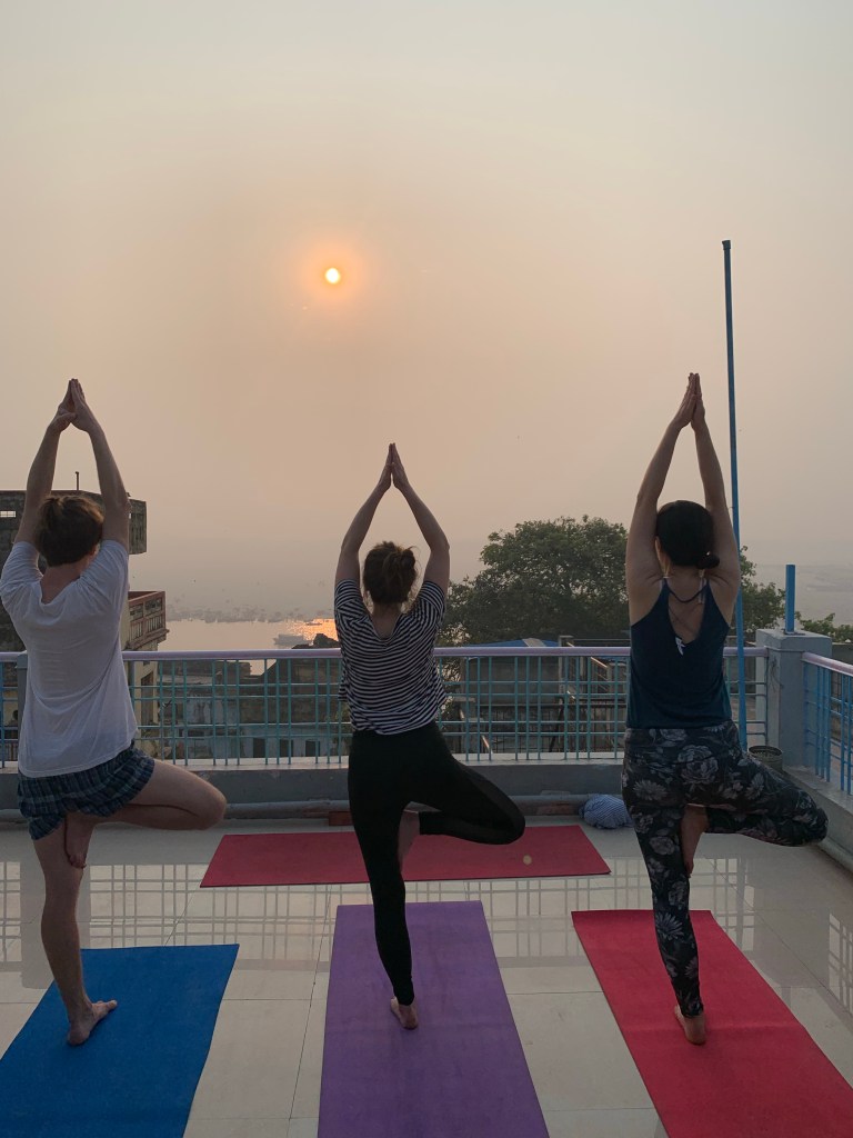 Yoga teacher Ayush students performing Tree Pose. 