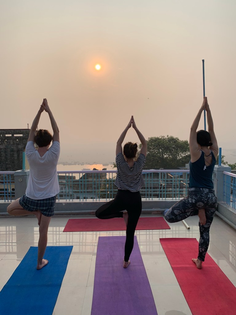 Yoga teacher Ayush students performing Vrikshasana. 