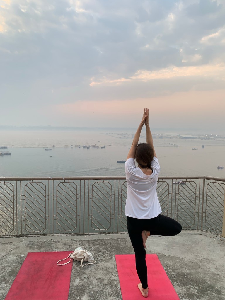 Yoga teacher Ayush student performing Tree Pose in Varanasi. 