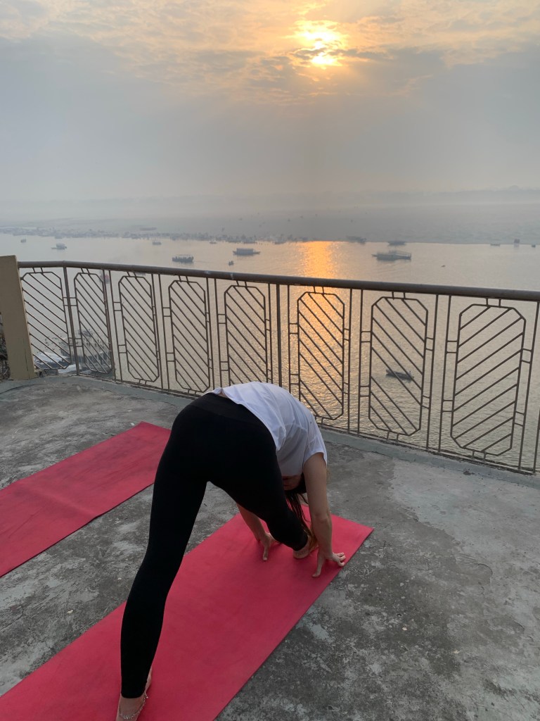 Yoga teacher Ayush student performing Parsvottanasana in Varanasi. 