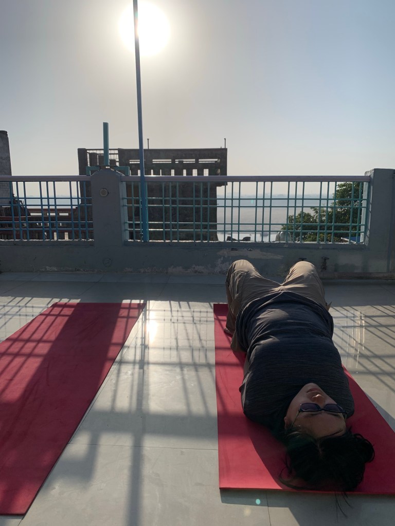 Yoga teacher Ayush student performing Setubandhasana in Varanasi. 