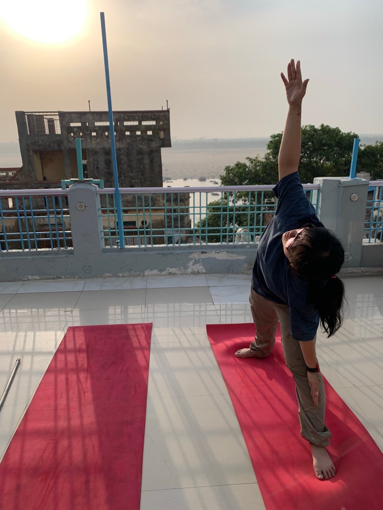Yoga teacher Ayush student performing Trikonasana in Varanasi. 