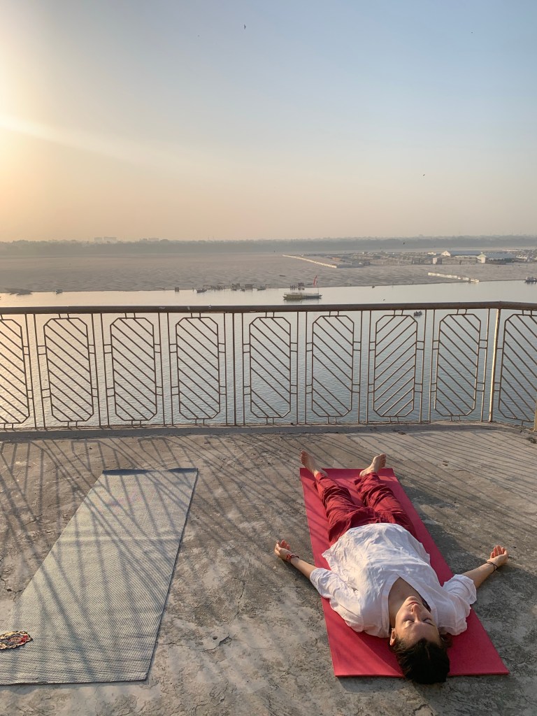 Yoga teacher Ayush student performing Shavasana in Varanasi.