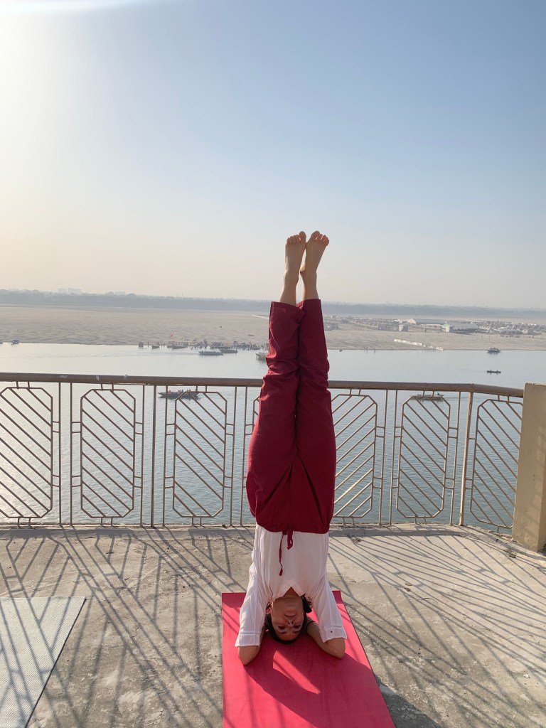 Yoga teacher Ayush student performing Headstand in Varanasi.
