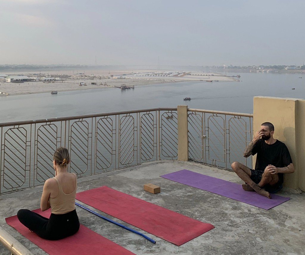 Yoga teacher Ayush students in meditation pose Varanasi. 