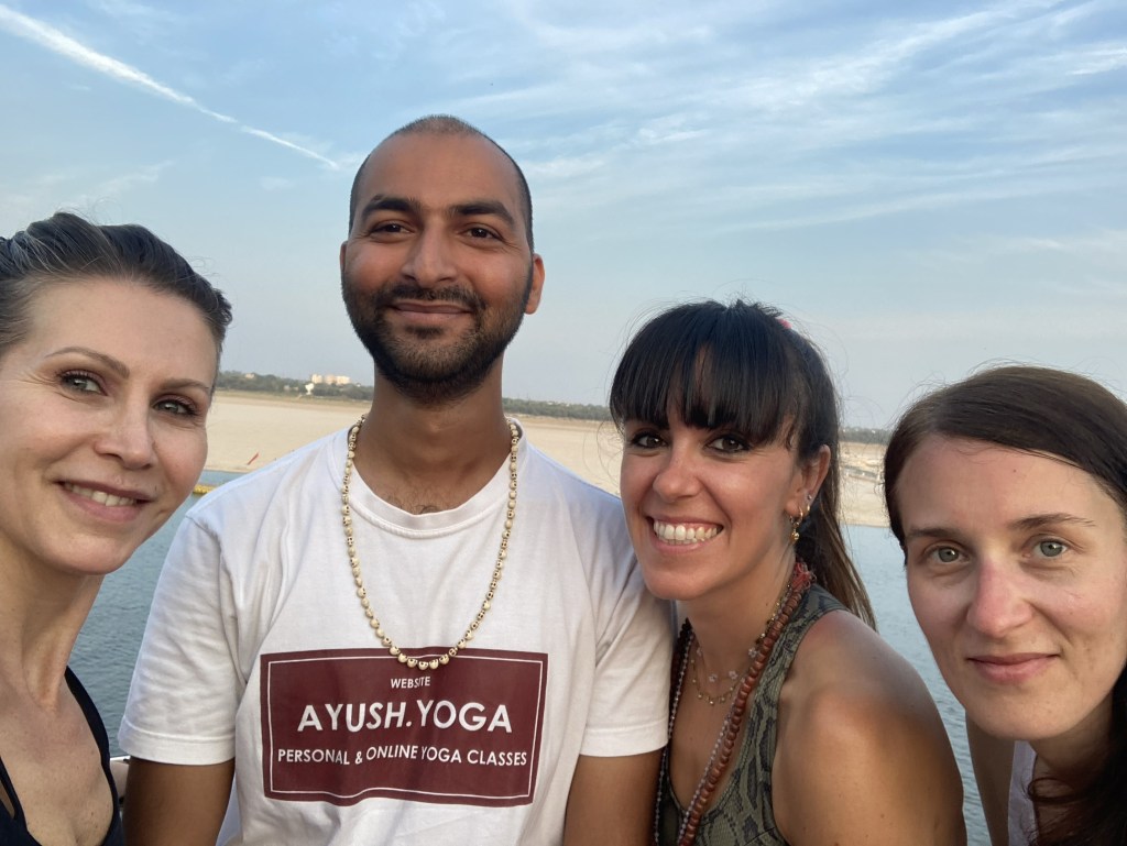 Students taking selfie with Yoga teacher Ayush after the session.