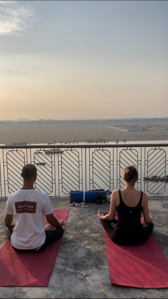 Yoga teacher Ayush with his student doing Sunrise Yoga in Varanasi. 