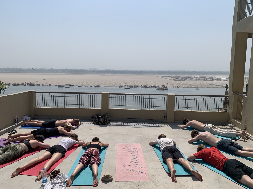 Yoga teacher Ayush students performing Viparit Shavasana in Varanasi. 