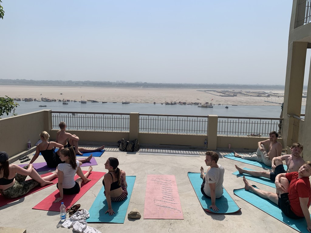 Yoga teacher Ayush students performing Spinal Twist Pose in Varanasi. 