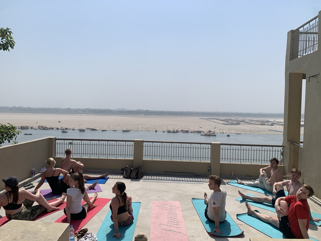 Yoga teacher Ayush students performing Ardhamatsyendrasana in Varanasi. 