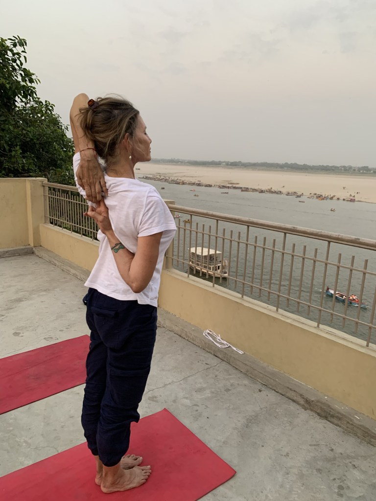 Yoga teacher Ayush student performing Gomukh Asana in Varanasi. 