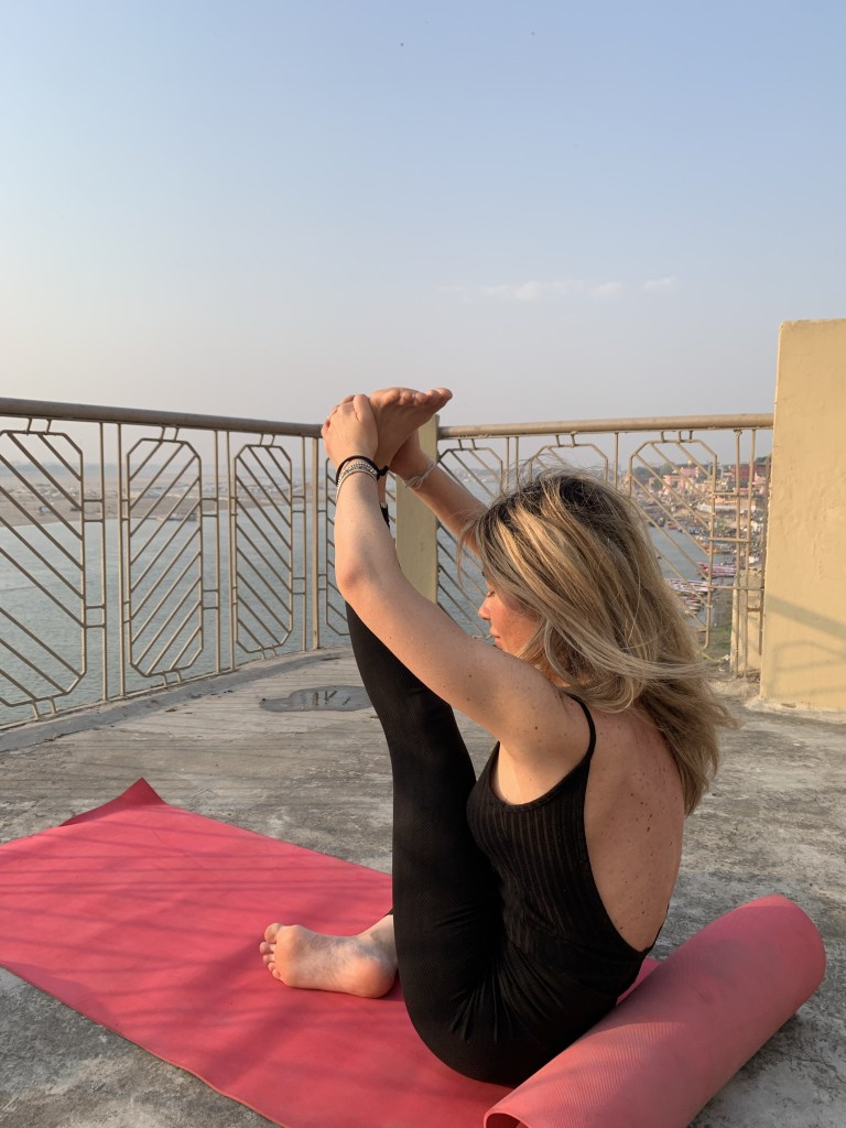 Yoga teacher Ayush student performing Staff Pose Vacation in Varanasi.