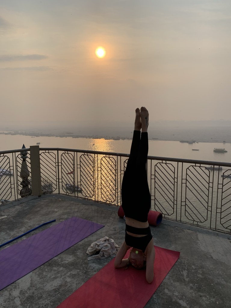 Yoga teacher Ayush student performing Salamba Shrishasan in Varanasi. 