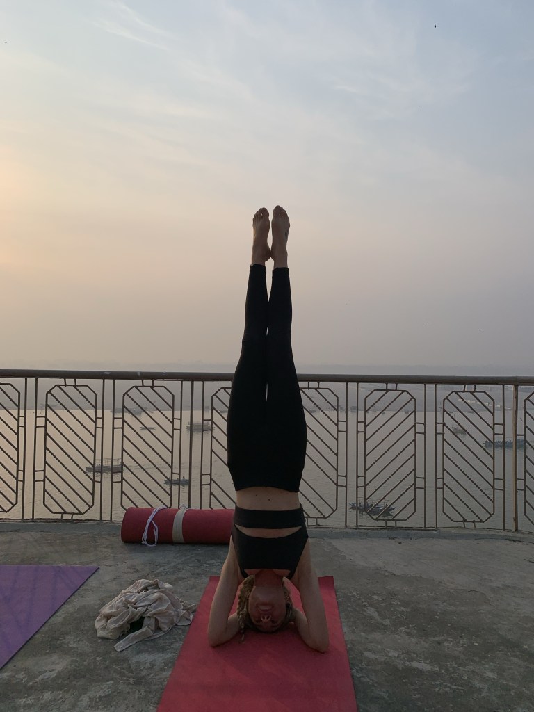 Yoga teacher Ayush student performing Headstand in Varanasi. 