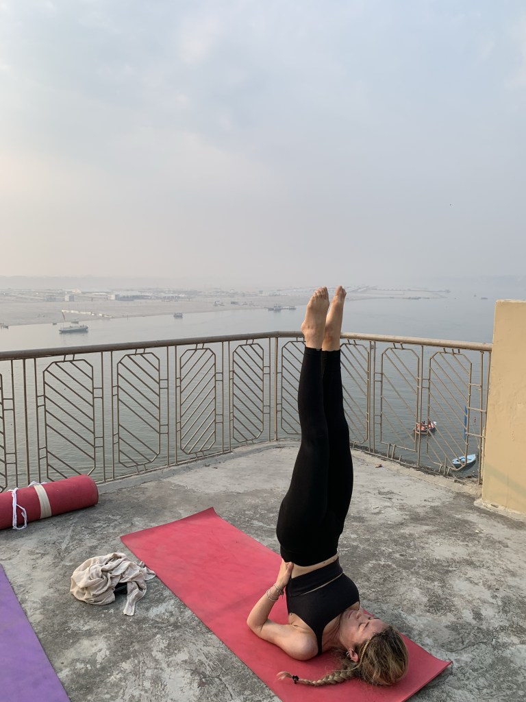 Yoga teacher Ayush student performing Shoulder Stand Pose in Varanasi. 